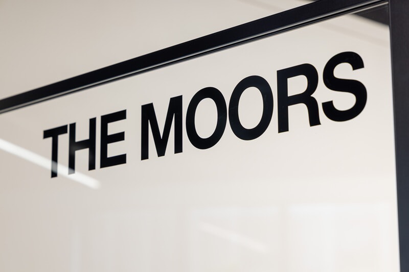 An image of The Moors office signage.